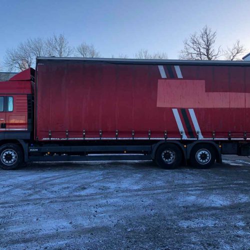 red man lorry exterior side view left